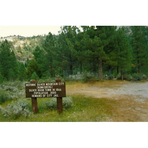 Sign post for Silver Mountain, with ruins of jail