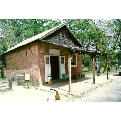 The Beckeart store at the bridge crossing into Coloma.  Its early use was as a gun shop, and it maintains the tradition today.